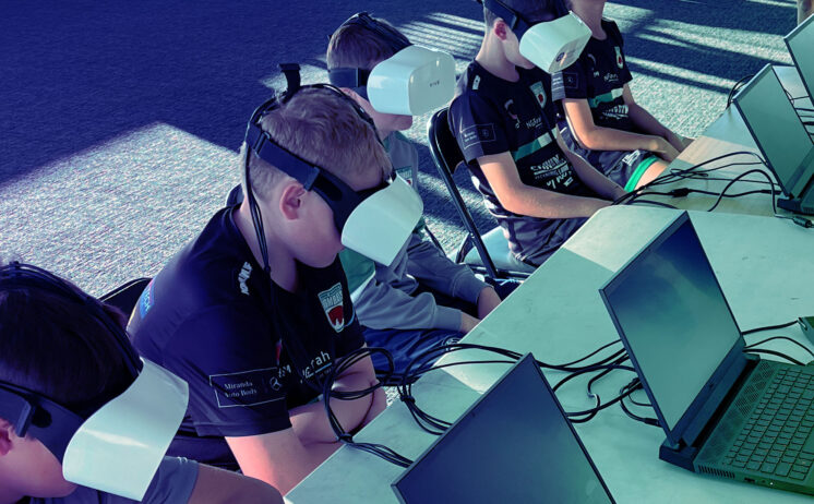 Children participating in a brain health screening assessment using a Neuroflex device