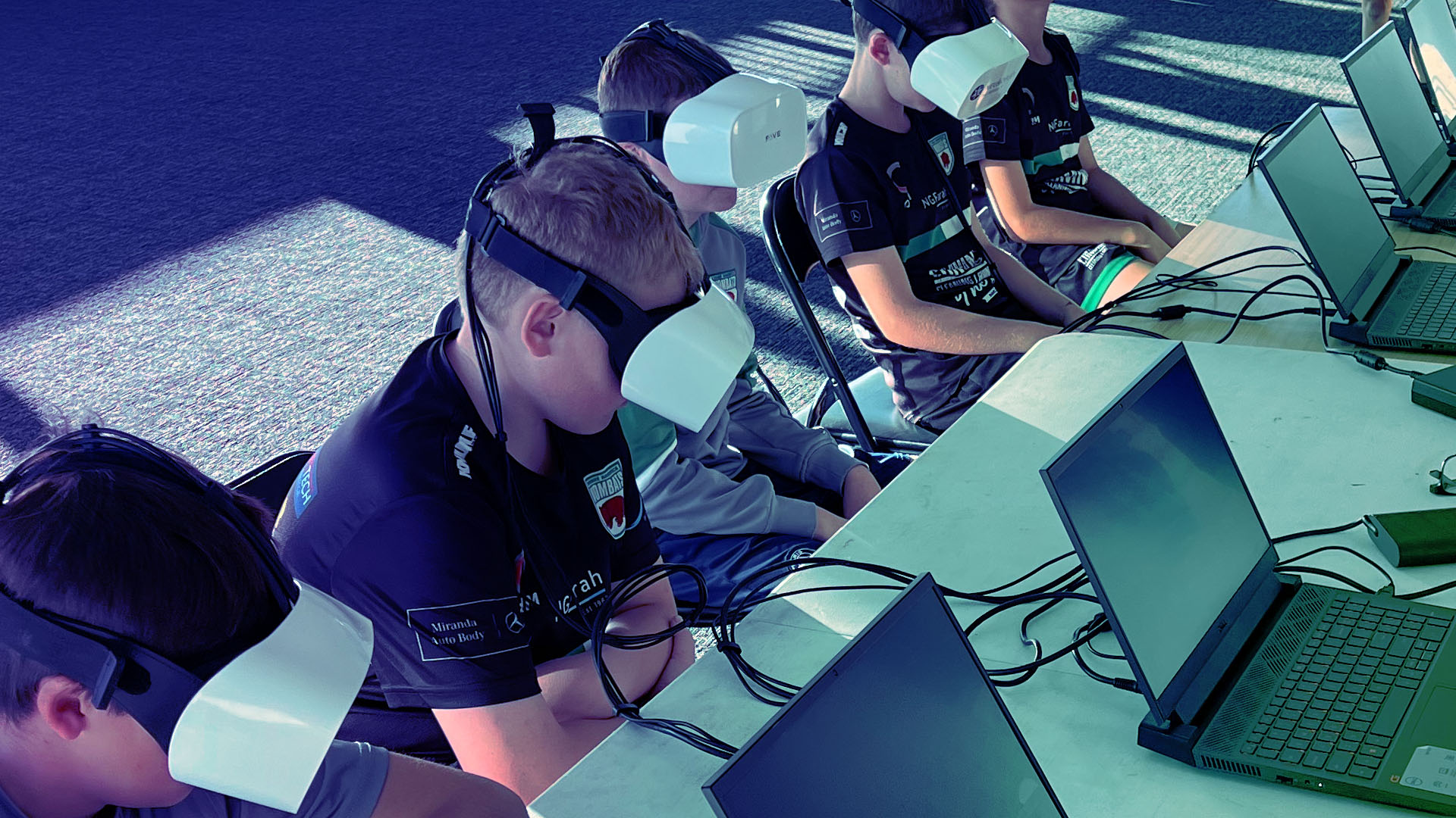 Children participating in a brain health screening assessment using a Neuroflex device